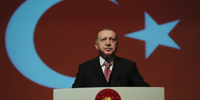 Turkey's President Recep Tayyip Erdogan delivers a speech during a military academy ceremony in Ankara, Turkey, Thursday Jan. 24, 2019. Erdogan says he is shocked by U.S. President Donald Trump's decision to recognise Venezuelan opposition leader Juan Guaido's claim to the presidency.(Presidential Press Service via AP, Pool)