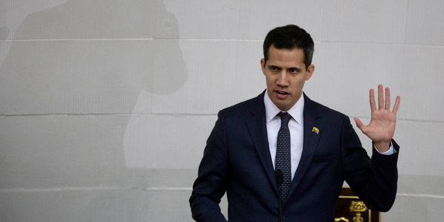 FILE - Venezuelan lawmaker Juan Guaido takes the oath of office as president of the National Assembly in Caracas, Venezuela. A coalition of Latin American governments that joined the U.S. in quickly recognizing Guaido as Venezuela’s interim president, and not Nicolas Maduro, came together during weeks of secret diplomacy. (AP Photo/Fernando Llano, File)