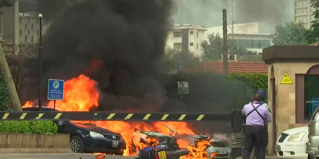 This frame taken from video shows a scene of an explosion in Kenya's capital, Nairobi, on Jan. 15. Gunfire and explosions were reported near an upscale hotel complex. (AP Photo/Josphat Kasire)