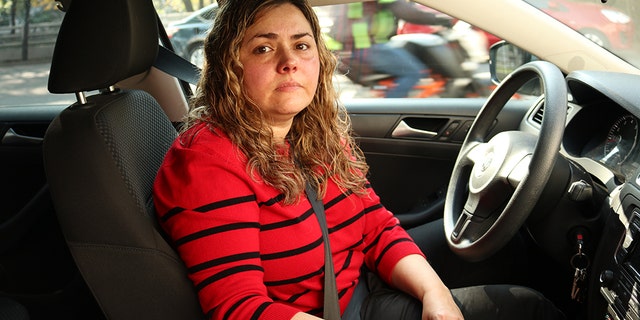 Martha Rodriguez waits to fill up in Mexico City