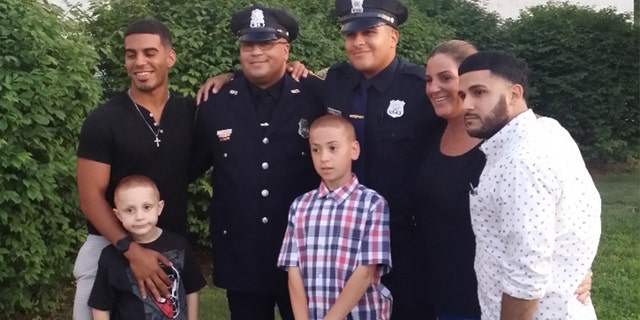 Debbie Roselle, second from right, is trying to seek changes to the benefits her husband Phil, second from left, is receiving after he was shot by a fellow officer during a gun range training session in 2017.
