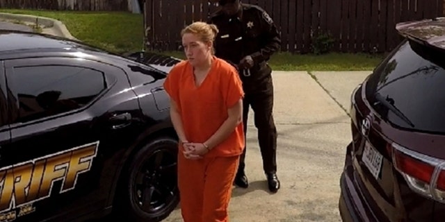 Fallon Blackwood walks into the Macon County, AL courthouse in October after authorities in North Carolina issued a warrant for obtaining property under false pretenses.