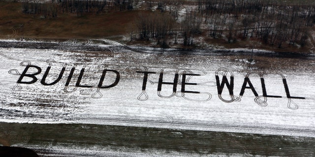 Farmer Gene Hanson of Edgeley, North Dakota plowed a message of support for President Trump: "Build the wall."