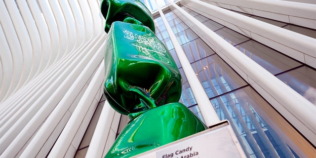 An art exhibit near Ground Zero in New York that features a piece of candy draped in the Saudi Arabian flag will be removed from the site, officials said.