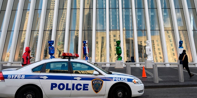 The green Saudi flag is draped around a sculpture, as pictured here outside the Oculus near Ground Zero.