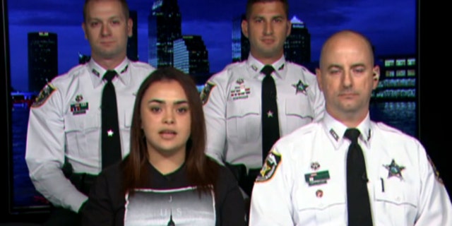 Amanda Antonio, joined by Hillsborough County Sheriff Deputy Chris Sullivan (right), Deputy Jeremy Pollack (top left) and Deputy Ryan Cooper (top right).