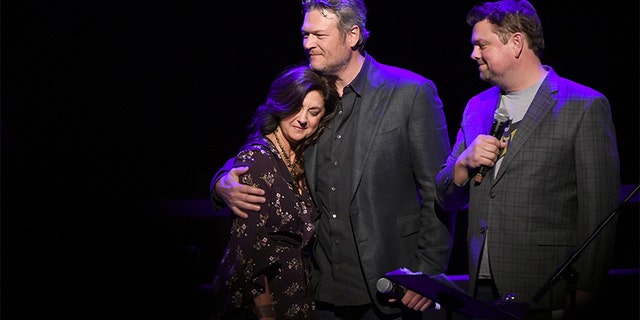 Angie Gentry, Blake Shelton and Storme Warren speak onstage during C'Ya on The Flipside benefit concert, benefitting The Troy Gentry Foundation at The Grand Ole Opry on January 9, 2019 in Nashville. — Getty