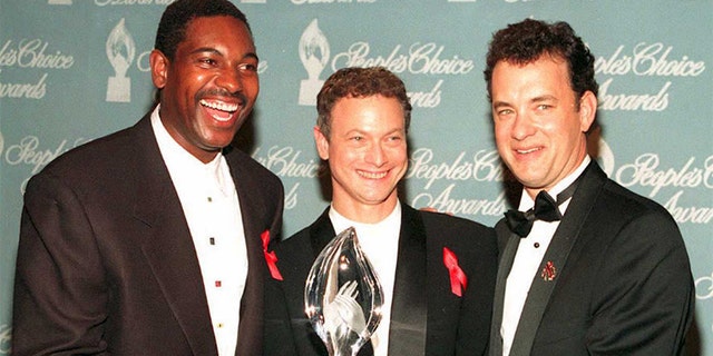 Mykelti Williamson, Gary Sinise and Tom Hanks, from the movie "Forrest Gump," pose with the award they won during the 21st Annual People's Choice Awards at Universal City Studios.