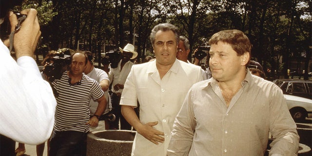 John Gotti, center, enters the Brooklyn Federal courthouse with Sammy "The Bull" Gravano in May 1986, in New York City. — Getty