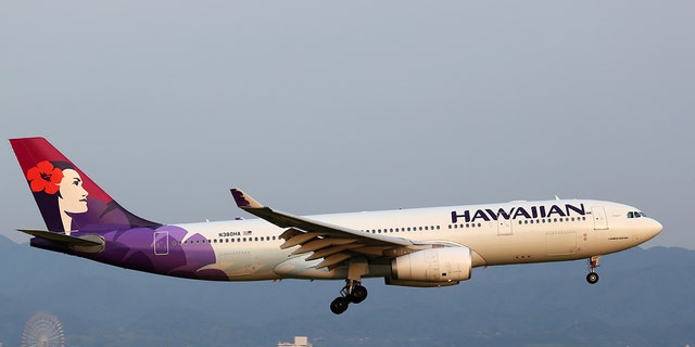Osaka Kansai, Japan - May 24, 2014: A Hawaiian Airlines Airbus A330-200 with the registration N380HA approaching Osaka Kansai Airport (KIX) in Japan. Hawaiian Airlines is a US airline based in Honolulu, Hawaii.