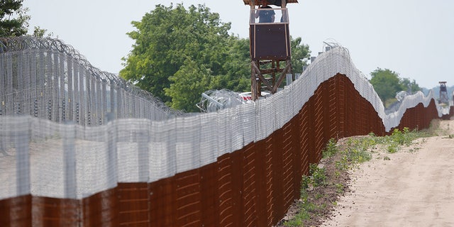 Hungarian soldiers patrol the Hungarian-Serbian border near the village of Tompa, Hungary, June 14, 2017.