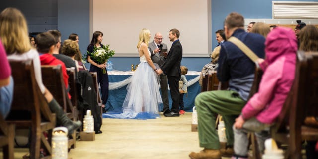 The couple initially “laughed” off a friend’s suggestion to hold their nuptials at “Feed My Starving Children,” they told Fox 9.