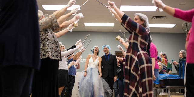 While the reception of 70 people included some dancing, much of it was spent packing meals, Fox 9 reported.