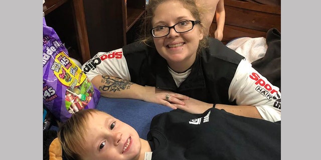 Leslie Brooke, one of the servers at Logan's Roadhouse who rushed out to help save Titus, brought gifts for him as he recovers at home. Sarah said
