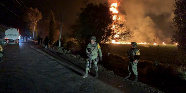 soldiers guard in the area near an oil pipeline explosion in Tlahuelilpan, Hidalgo state, Mexico, Friday, Jan. 18, 2019. (Associated Press)
