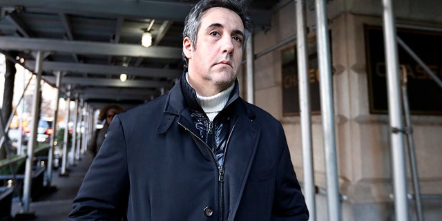 FILE - In this Dec. 7, 2018 file photo, Michael Cohen, former lawyer to President Donald Trump, leaves his apartment building in New York. A report by BuzzFeed News, citing two unnamed law enforcement officials, says that Trump directed Cohen to lie to Congress and that Cohen regularly briefed Trump on the project. The Associated Press has not independently confirmed the report. (AP Photo/Richard Drew, File)
