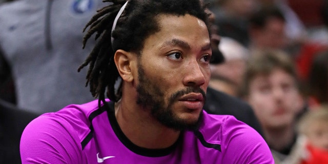 Derrick Rose #25 of the Minnesota Timberwolves watches from the bench as teammates take on the Chicago Bulls at the United Center on December 26, 2018 in Chicago, Illinois.