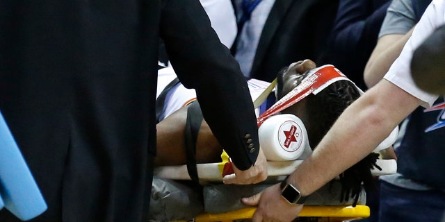 Oklahoma City Thunder forward Nerlens Noel is wheeled off the court on a stretcher in the second half of an NBA basketball game against the Minnesota Timberwolves in Oklahoma City, Tuesday, Jan. 8, 2019.