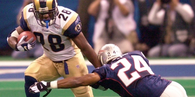 Running back Marshall Faulk was a key piece of the St. Louis Rams' "Greatest Show on Turf." (AP Photo/Tony Gutierrez, File)
