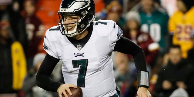 Philadelphia Eagles quarterback Nate Sudfeld (7) runs off the field with the ball after wide receiver Nelson Agholor's touchdown during the second half of the NFL football game against the Washington Redskins.