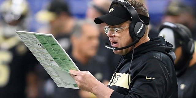 New Orleans Saints head coach Sean Payton looks over plays on the sidelines in the first half of an NFL divisional playoff football game against the Philadelphia Eagles, in New Orleans, Sunday, Jan. 13, 2019.