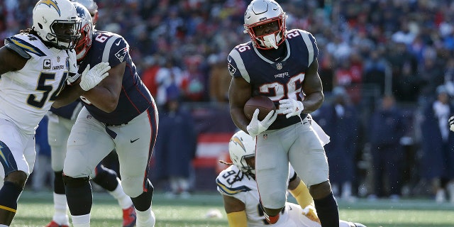 New England Patriots running back Sony Michel heads for the goal line and his second touchdown during the first half of an NFL divisional playoff football game against the Los Angeles Chargers.
