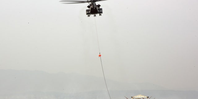 File photo - POHANG, Republic of Korea (March 29, 2016) An MH-53C assigned to Helicopter Mine Countermeasures Squadron (HM) 14 Detachment 2A links to an MK Magnetic Minesweeping System for Aircraft Mine Countermeasures (AMCM) exercises during Foal Eagle.