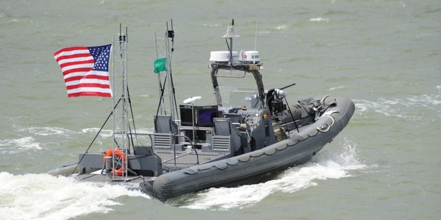 An unmanned 11-meter rigid-hull inflatable boat from Naval Surface Warfare Center Carderock on the James River in Newport News, Va.