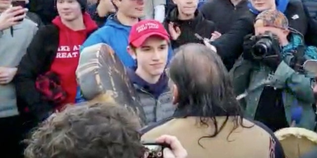 In this Friday, Jan. 18, 2019 image made from video provided by the Survival Media Agency, a teenager wearing a