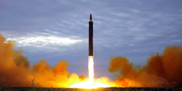This picture from North Korea's official Korean Central News Agency (KCNA) taken on August 29, 2017 and released on August 30, 2017 shows North Korea's intermediate-range strategic ballistic rocket Hwasong-12 lifting off from the launching pad at an undisclosed location near Pyongyang. (Photo credit STR/AFP/Getty Images)
