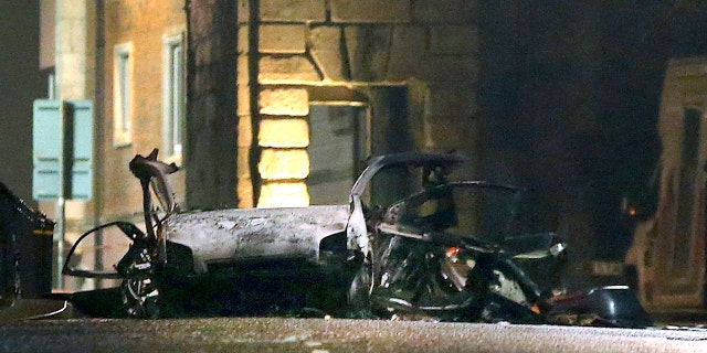 This photo taken on Saturday, Jan. 19, 2019 shows the scene of a suspected car bomb on Bishop Street in Londonderry, Northern Ireland.