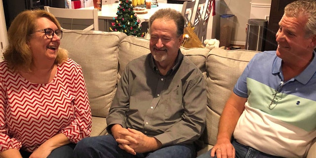 On New Year's Day, Pam and Mike Hodgin reunited with Chris Petersen, whom they consider their hero.