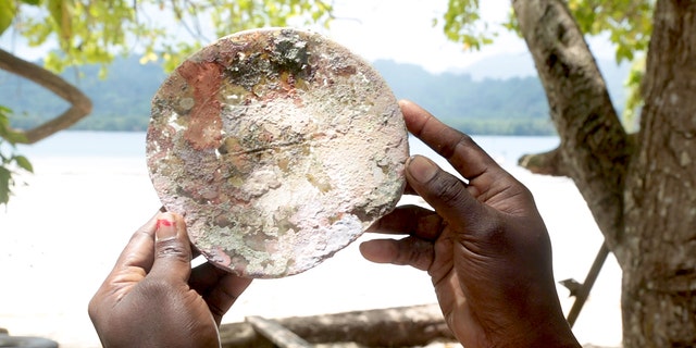 The remains of what appears to be the glass face of a light were recovered from the wreck site.