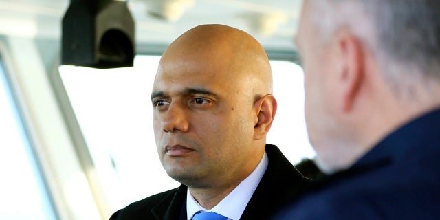British Home Secretary Sajid Javid, meets Border Force staff on board HMC Searcher, in Dover, England, on Wednesday. (Gareth Fuller/PA via AP)