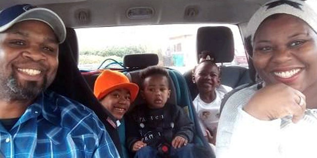 The Shaw family in their car.