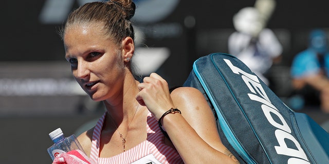 Karolina Pliskova of the Czech Republic leaves Rod Laver Arena after defeating United States' Serena Williams in their quarterfinal match at the Australian Open tennis championships in Melbourne, Australia, Wednesday, Jan. 23, 2019.