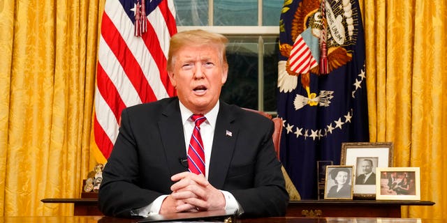 President Donald Trump speaks from the Oval Office of the White House as he gives a prime-time address about border security Tuesday, Jan. 8, 2018, in Washington. (Carlos Barria/Pool Photo via AP)