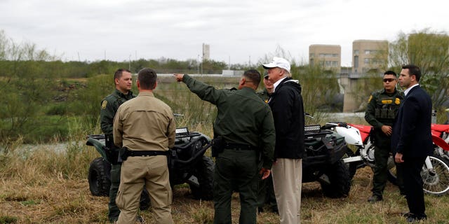 President Donald Trump tours the U.S. border with Mexico at the Rio Grande on the southern border, Thursday, Jan. 10, 2019, in McAllen, Texas. (AP Photo/ Evan Vucci)