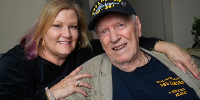 In this Tuesday, Jan. 8, 2019 photo Sue Morse and her dad Duane Sherman, 96, pose for a photo at their home in Fullerton, Calif. Sue posted on social media asking friends to send him a birthday card to cheer him up. It went viral and they've received over 50,000 cards and gifts so far.