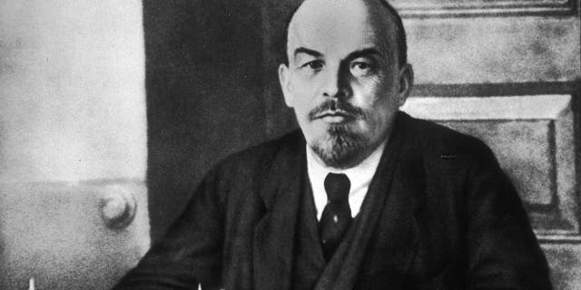 Portrait of Russian revolutionary leader Vladimir Lenin sitting at a table during a meeting of the Sovnarkom. (Photo by Hulton Archive/Getty Images)