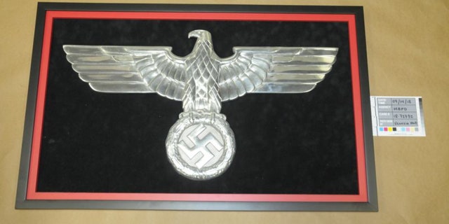 Police also found this Nazi eagle logo that was prominently displayed in Stolper’s apartment.