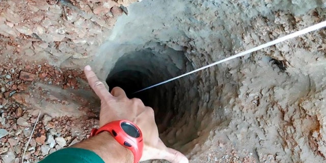 Rescuers believe the boy fell into the 100-meter-deep well after walking away from his parents.