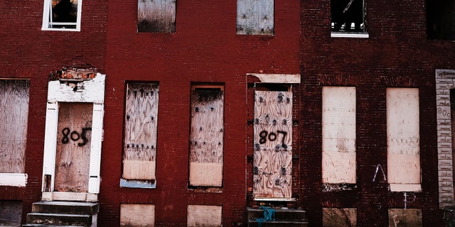 BALTIMORE, MD - FEBRUARY 03: Abandoned buildings stand in a neighborhood with a high murder rate on February 3, 2018 in Baltimore, Maryland.