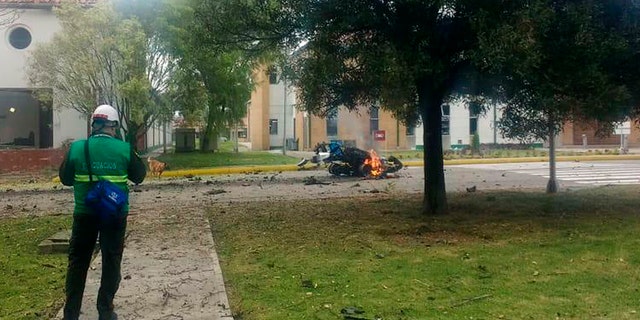 In this image provided by military personnel, flames rise from a deadly car bombing at a police academy on Thursday, in Bogota, Colombia. (AP Photo)