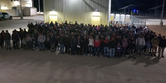 United States Border Patrol agents in New Mexico encountering a large group of immigrants.