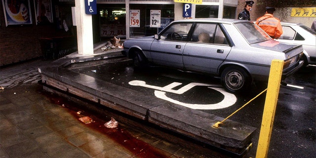 View of the parking lot of a Delhaize supermarket in Alost November 10, 1985, the day after an attack by the "Brabant killers". Police have failed to solve the "Brabant Killings" when a band of gunmen sowed terror in central Belgium between 1983 and 1985 by attacking supermarkets and indiscriminately shooting customers. At least 28 people died in the attacks.