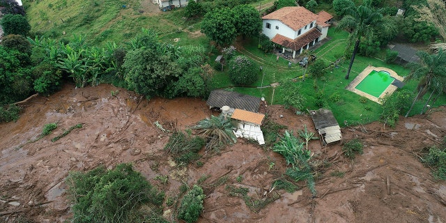 An aerial view shows a partially destroyed house after a dam collapsed, in Brumadinho, Brazil, Saturday, Jan. 26, 2019. (Associated Press)