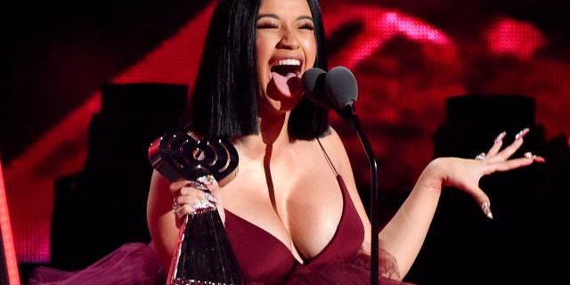 In this March 11, 2018, file photo, Cardi B accepts the Best New Artist award during the 2018 iHeartRadio Music Awards in Inglewood, Calif.