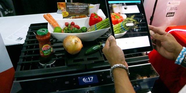 Whirlpool Corporation and Yummly team up to create smart cooking appliances through a series of over the air updates to both product software and the Whirlpool and Yummly Guided Cooking brand apps, at the CES Unveiled at CES International Sunday, Jan. 6, 2019, in Las Vegas. (AP Photo/Ross D. Franklin)