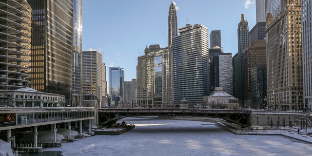 Ice covers the Chicago River Wednesday, Jan. 30, 2019, in Chicago as a deadly arctic deep freeze enveloped the Midwest with record-breaking temperatures. (AP Photo/Teresa Crawford)